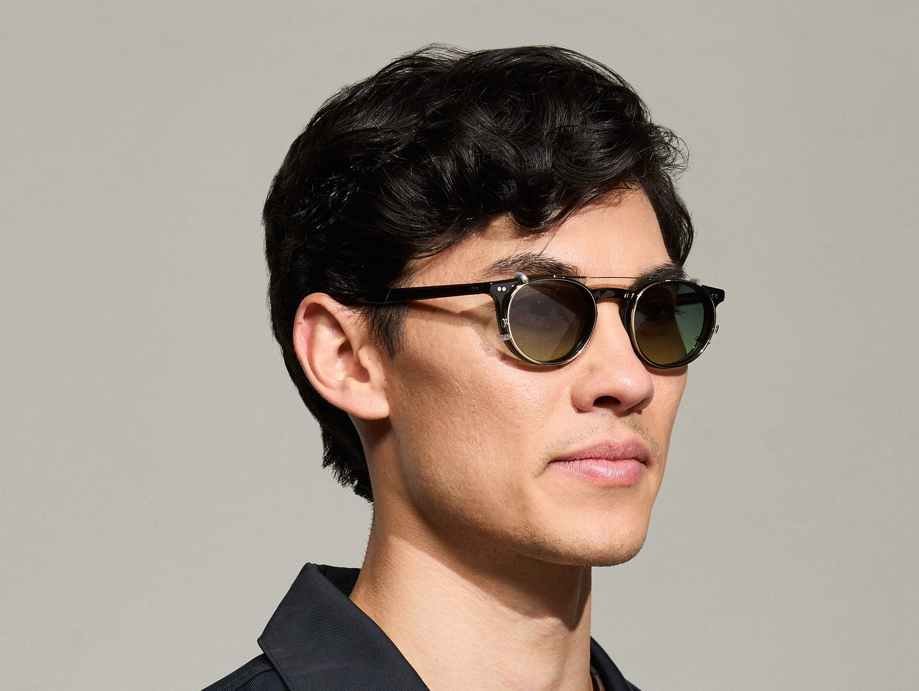 Model is wearing The FRANKIE CLIP in Gold in size 48 with Forest Wood Tinted Lenses