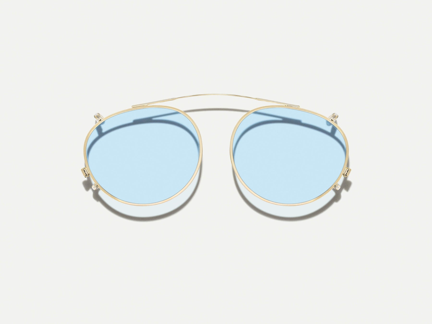 The FRANKIE CLIP  in Gold with Bel Air Blue Tinted Lenses