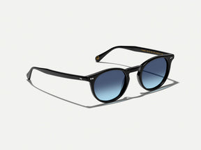 #color_black | The FRANKIE SUN in Black with Denim Blue Tinted Lenses