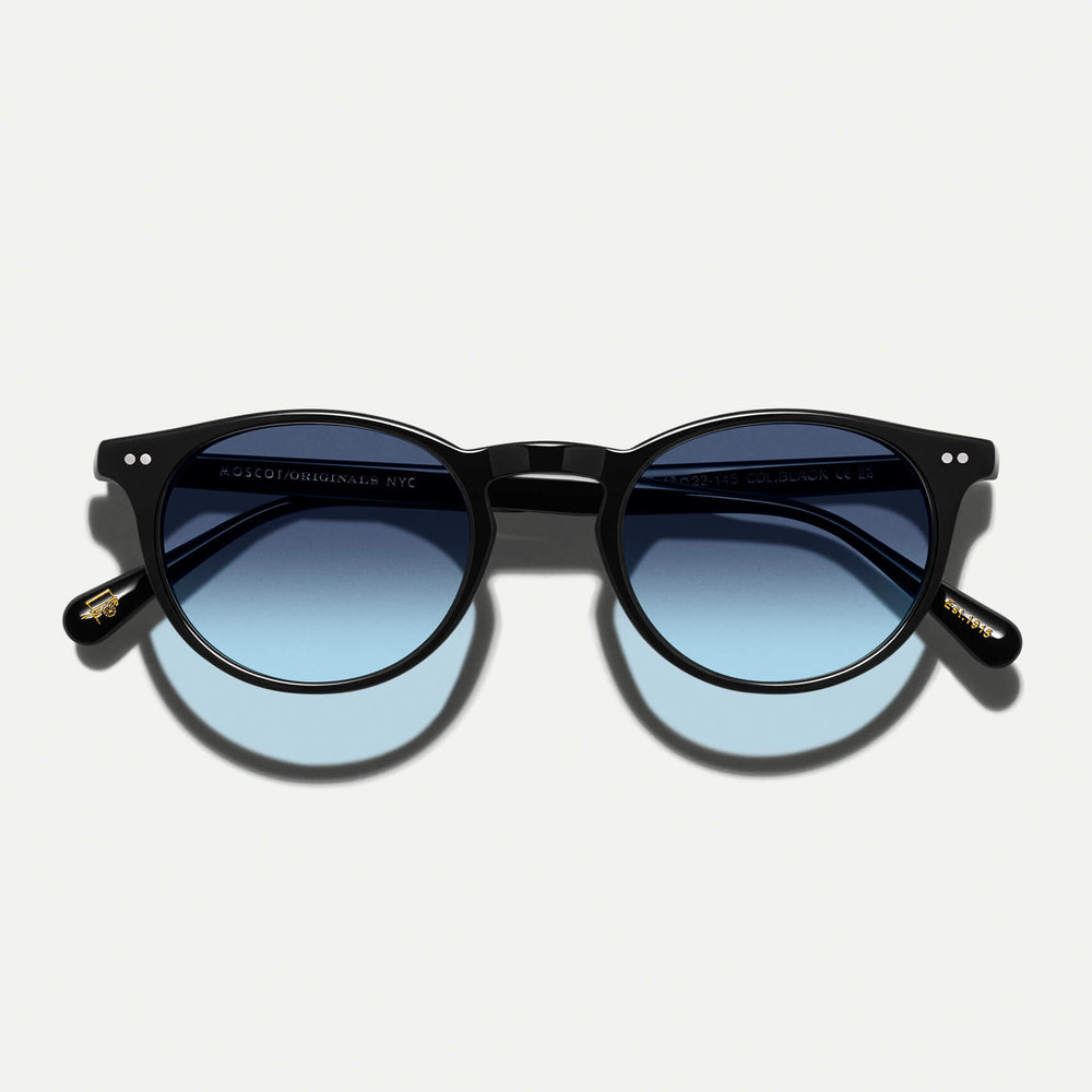 #color_black | The FRANKIE SUN in Black with Denim Blue Tinted Lenses