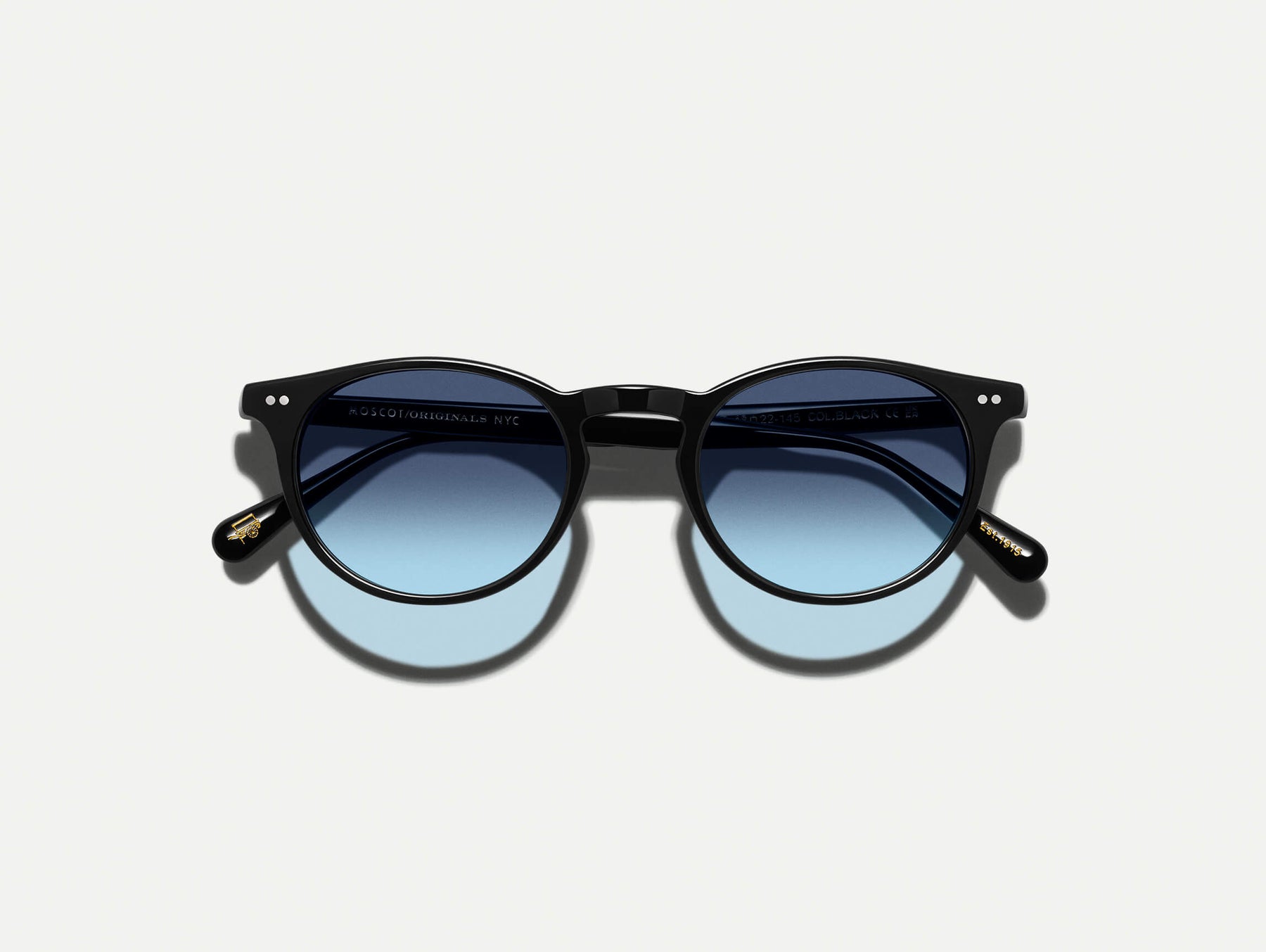 The FRANKIE SUN in Black with Denim Blue Tinted Lenses