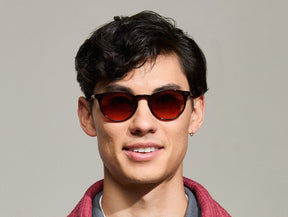 Model is wearing The FRANKIE SUN in Burgundy in size 51 with Cabernet Tinted Lenses