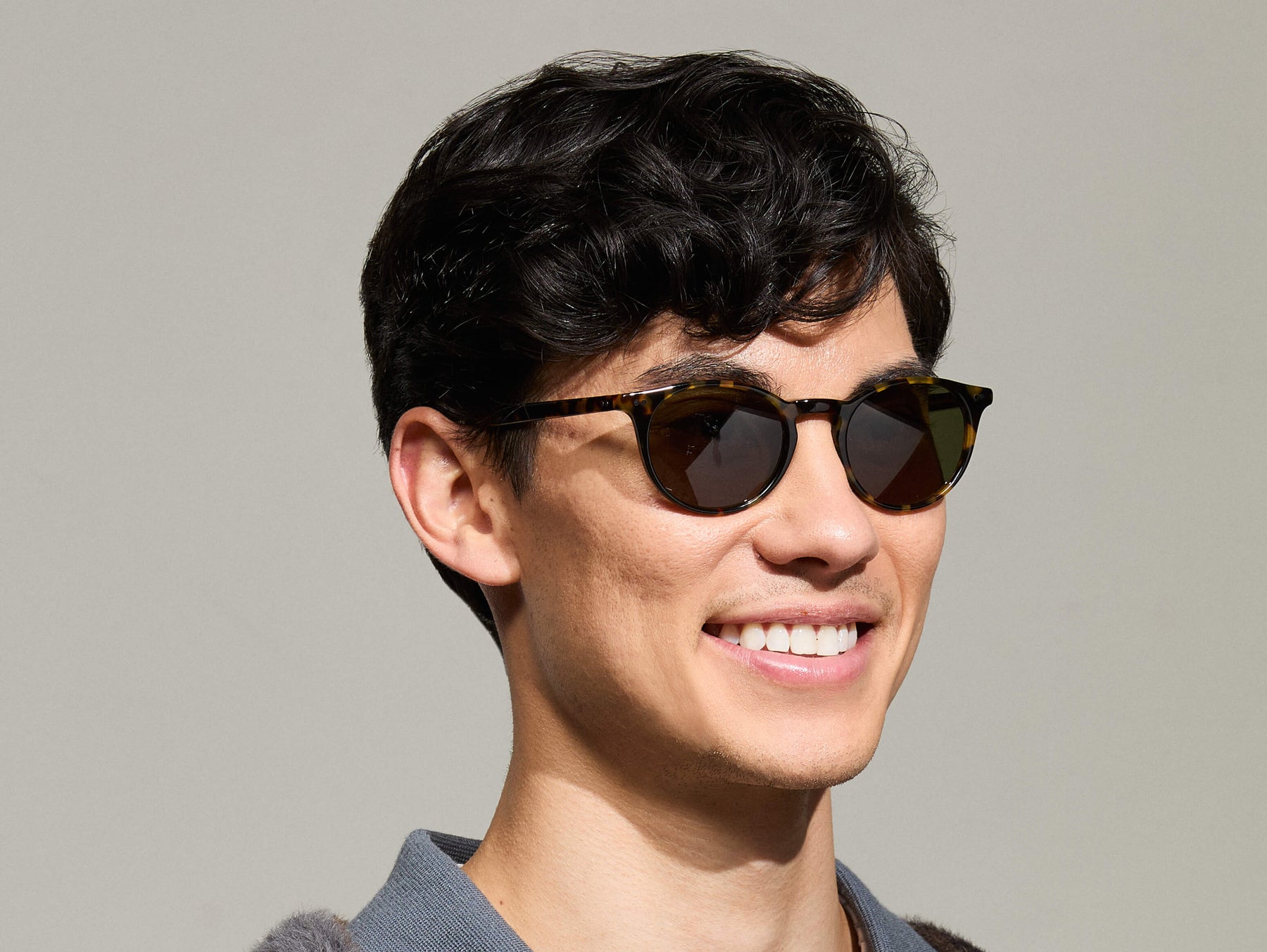 Model is wearing The FRANKIE SUN in Tortoise in size 51 with Ever Green Tinted Lenses