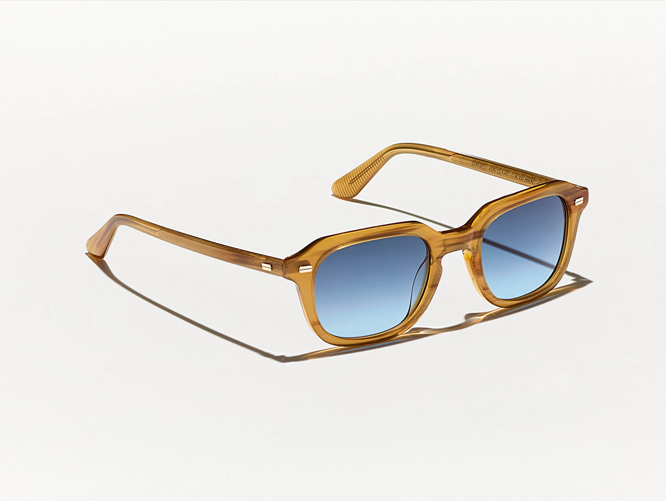 #color_blonde | The GATKES SUN in Blonde with Denim Blue Tinted Lenses