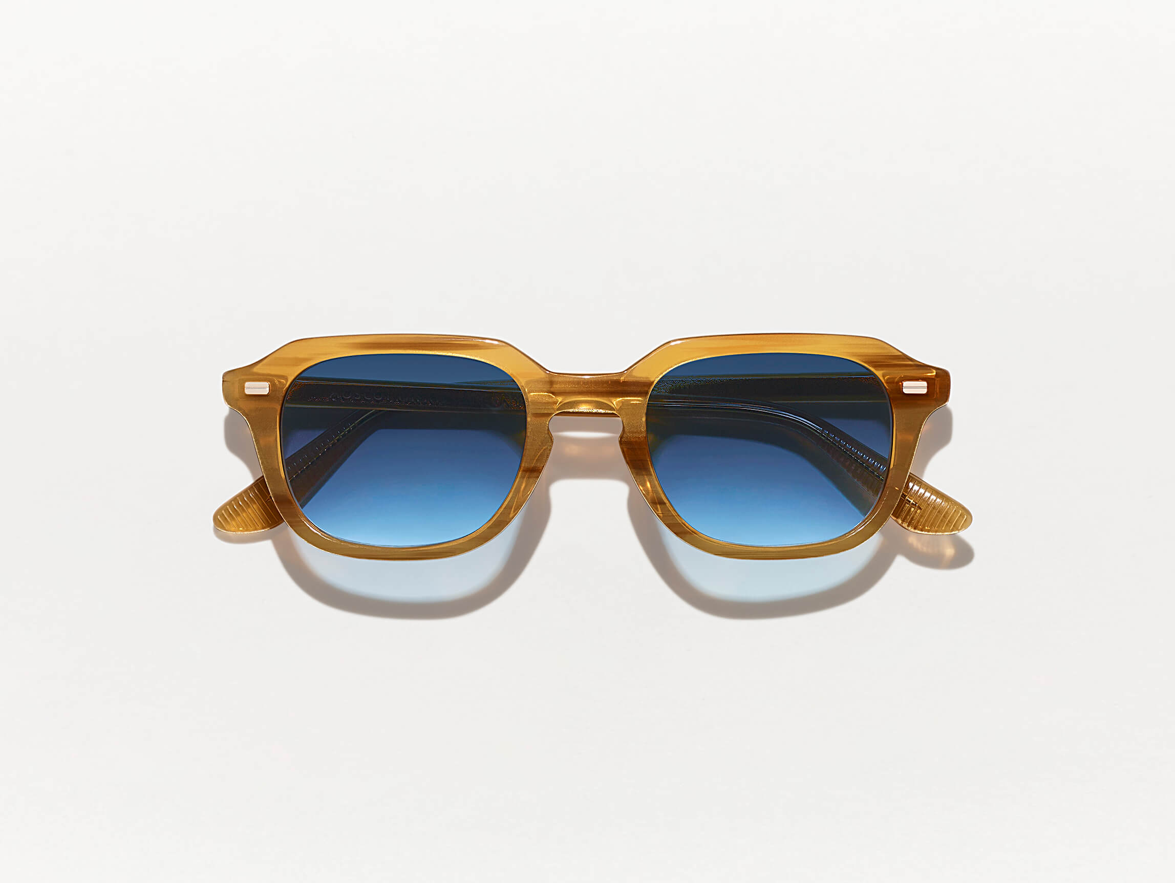 #color_blonde | The GATKES SUN in Blonde with Denim Blue Tinted Lenses