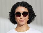 Model is wearing The GAVOLT SUN in Black in size 48 with Cabernet Tinted Lenses