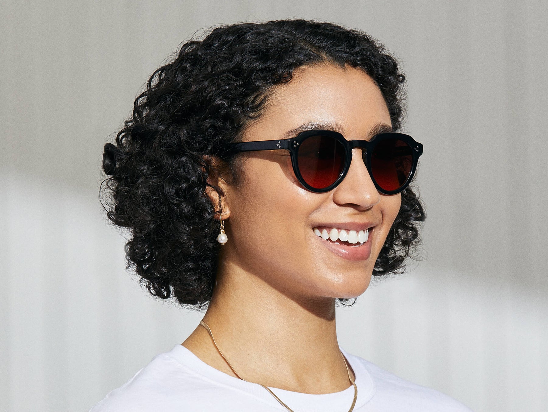 Model is wearing The GAVOLT SUN in Black in size 48 with Cabernet Tinted Lenses