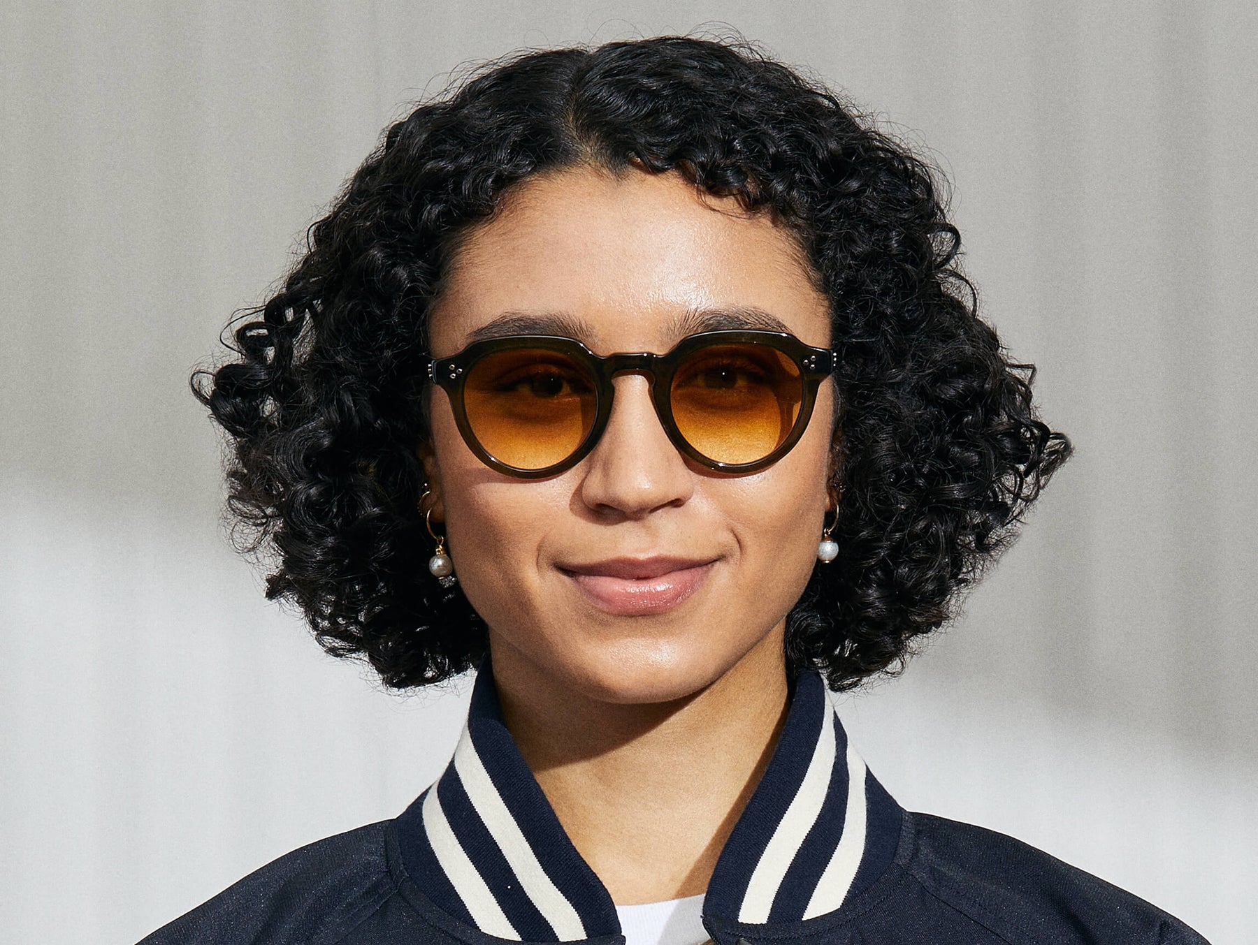 Model is wearing The GAVOLT SUN in Dark Green in size 48 with Chestnut Fade Tinted Lenses