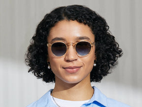 Model is wearing The GAVOLT SUN in Flesh/Tortoise in size 48 with Denim Blue Tinted Lenses