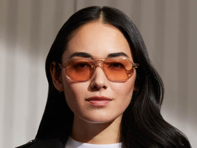 Model is wearing The GAZEEKTAL in Burnt Rose in size 55 with New York Rose Tinted Lenses