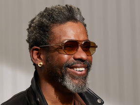 Model is wearing The GAZEEKTAL SUN in Cinnamon in size 55 with Chestnut Fade Tinted Lenses