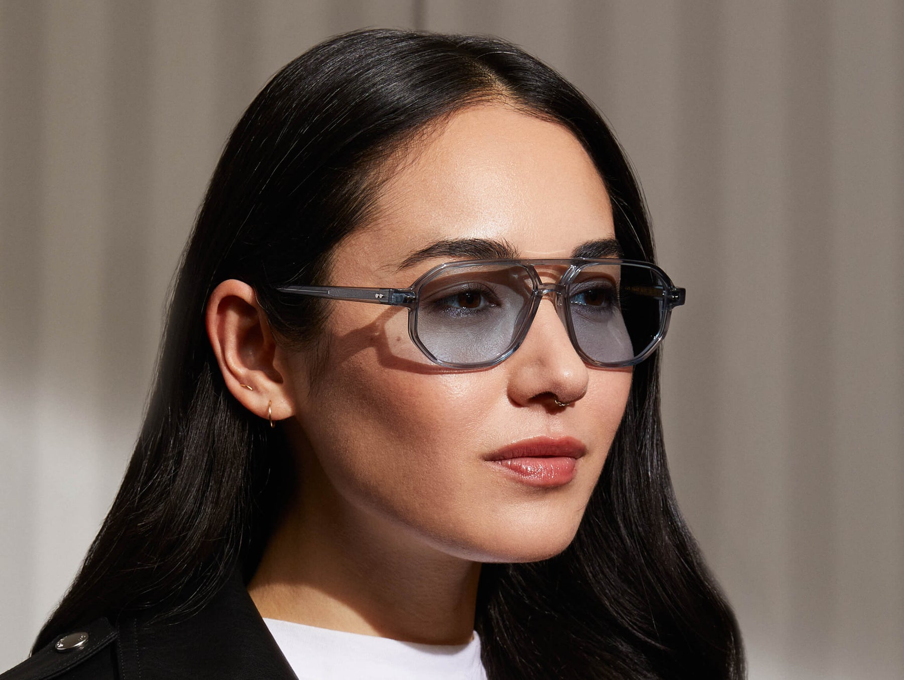 Model is wearing The GAZEEKTAL SUN in Light Blue in size 55 with Bel Air Blue Tinted Lenses