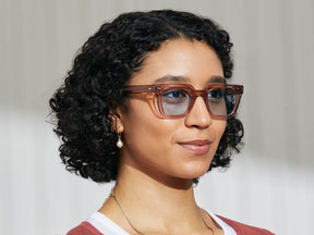 Model is wearing The GROBER SUN in Vintage Rose in size 48 with Bel Air Blue Tinted Lenses