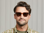 Model is wearing The GROBER SUN in Tobacco in size 48 with G-15 Lenses