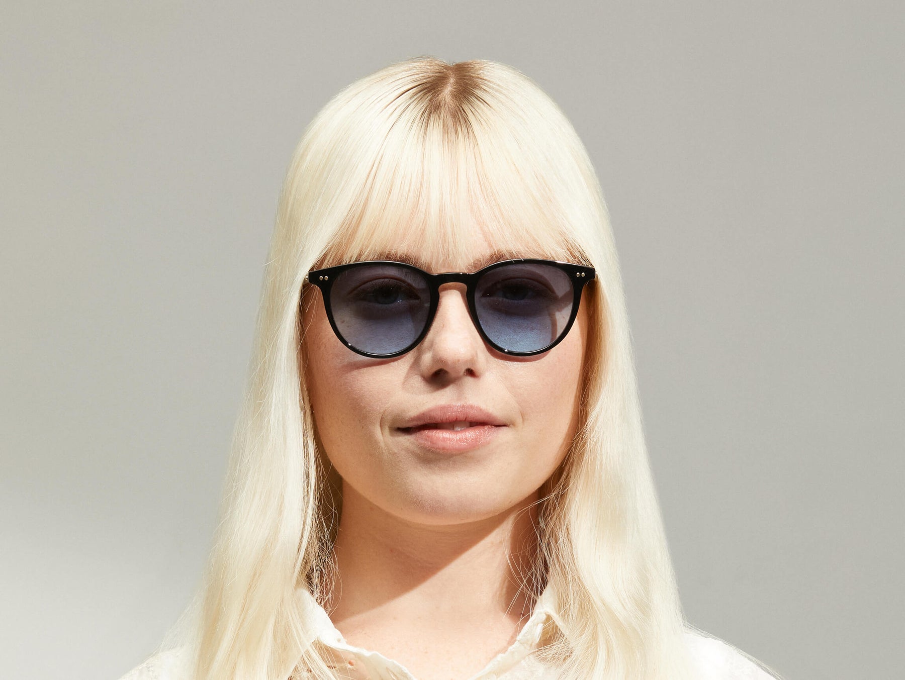 Model is wearing The JARED SUN in size 50 in Black with Denim Blue Tinted Lenses