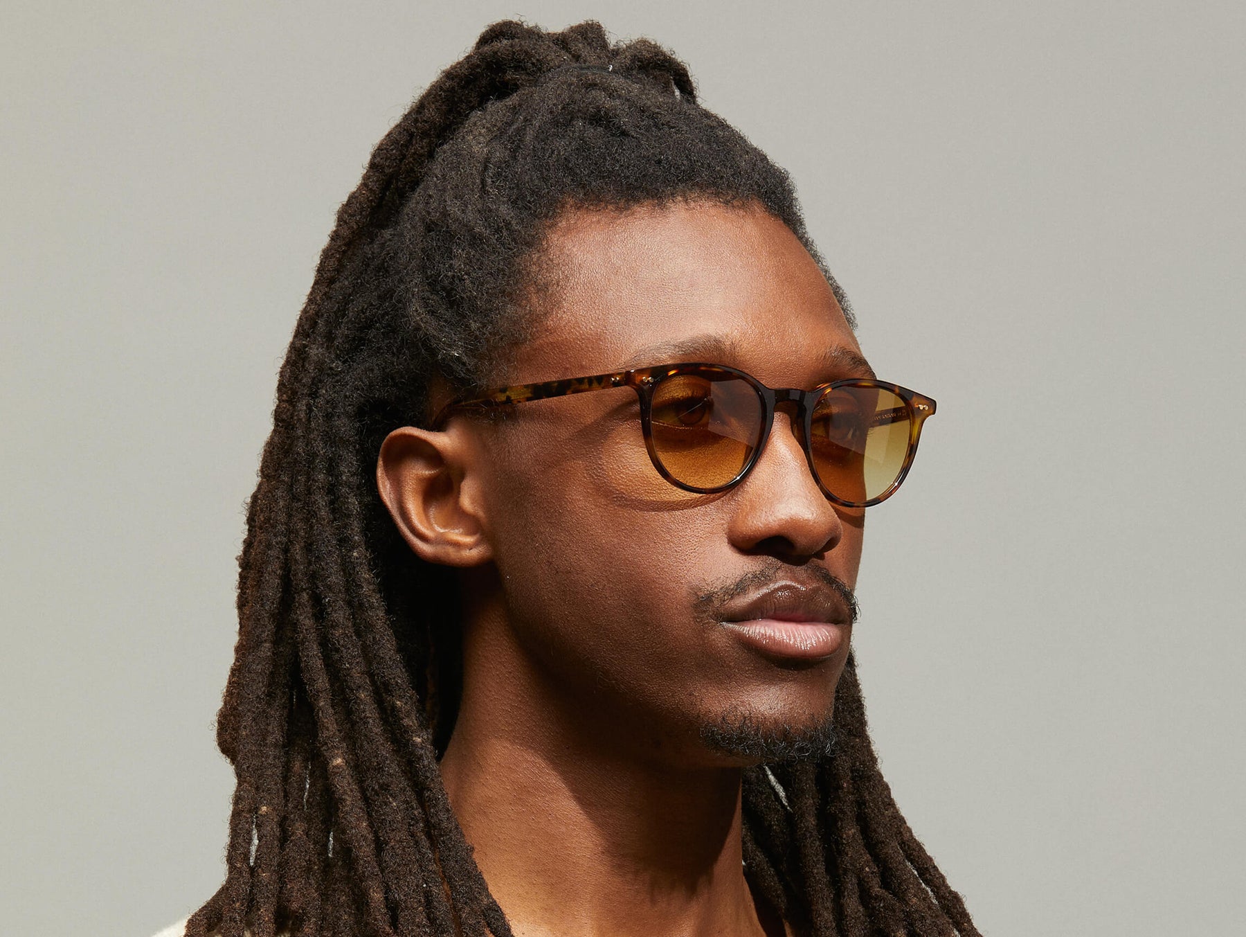 Model is wearing The JARED SUN in size 50 in Spot Tortoise with Chestnut Fade Tinted Lenses