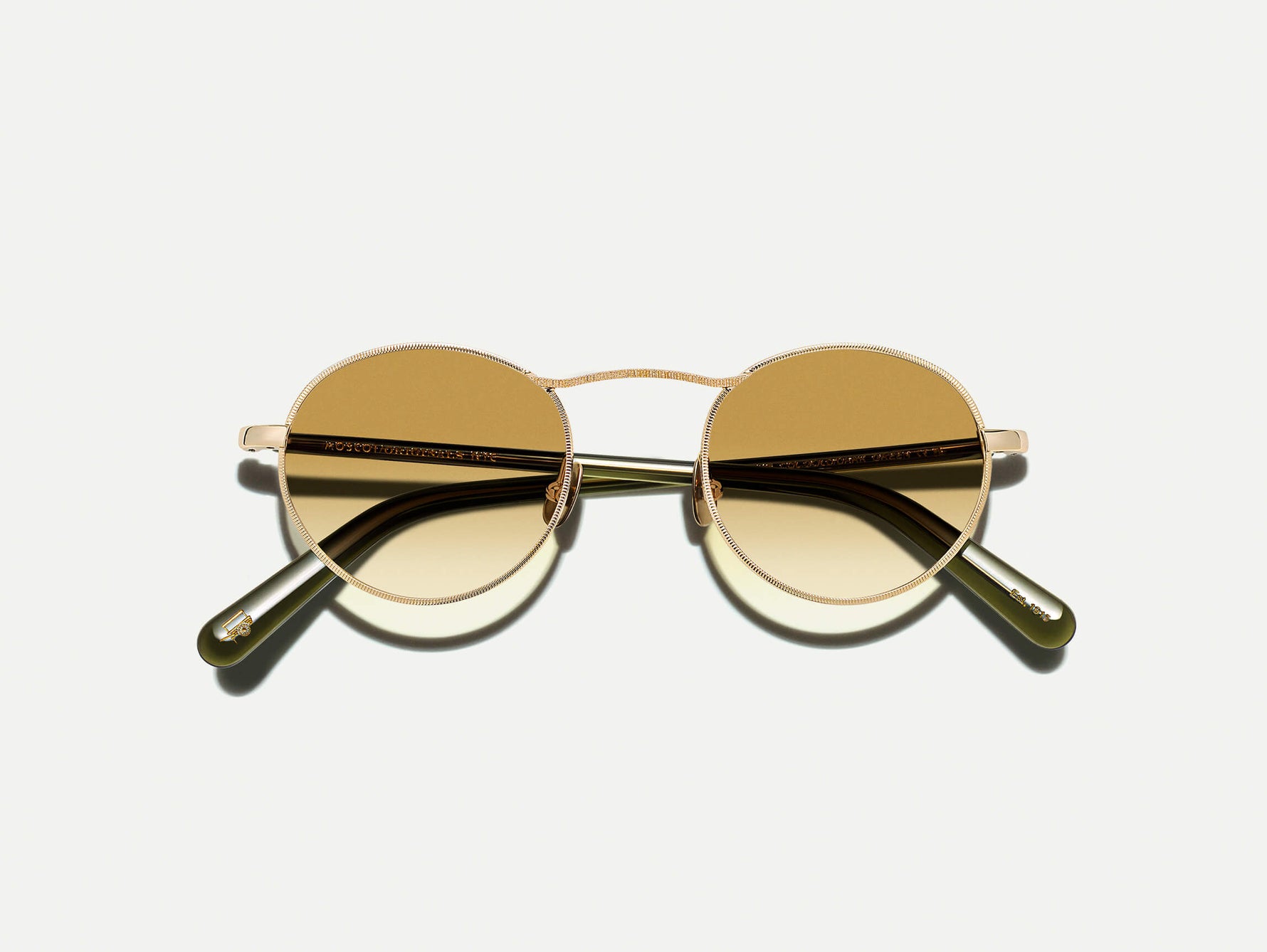 #color_gold/dark green | The KANAKA SUN in Gold/Dark Green with Chestnut Fade Tinted Lenses