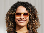 Model is wearing The LEMTOSH in Blonde in size 46 with City Lights Tinted Lenses