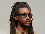 Model is wearing The LEMTOSH in Ink in size 46 with BLUE+ Tinted Lenses