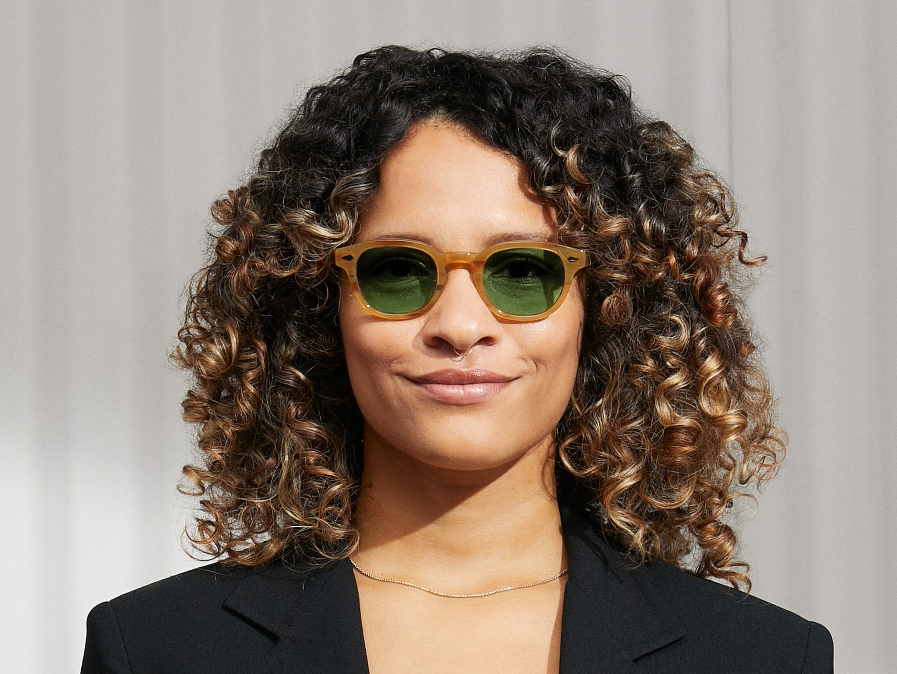 Model is wearing The LEMTOSH in Blonde size 46 with GREEN+ Tinted Lenses