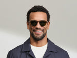 Model is wearing The LEMTOSH SUN in size 46 in Cognac with Calibar Green Tinted Lenses