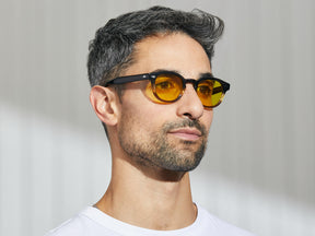 Model is wearing The LEMTOSH in Grey-Brown Fade in size 46 with Mellow Yellow Tinted Lenses