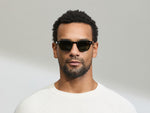 Model is wearing The LEMTOSH SUN-POLARIZED in size 46 in Black with G-15 Glass Polarized Lenses