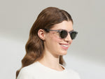 Model is wearing The LEMTOSH SUN in size 49 in Light Grey with G-15 Glass Lenses