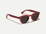 The LEMTOSH SUN in Ruby with Grey Glass Lenses