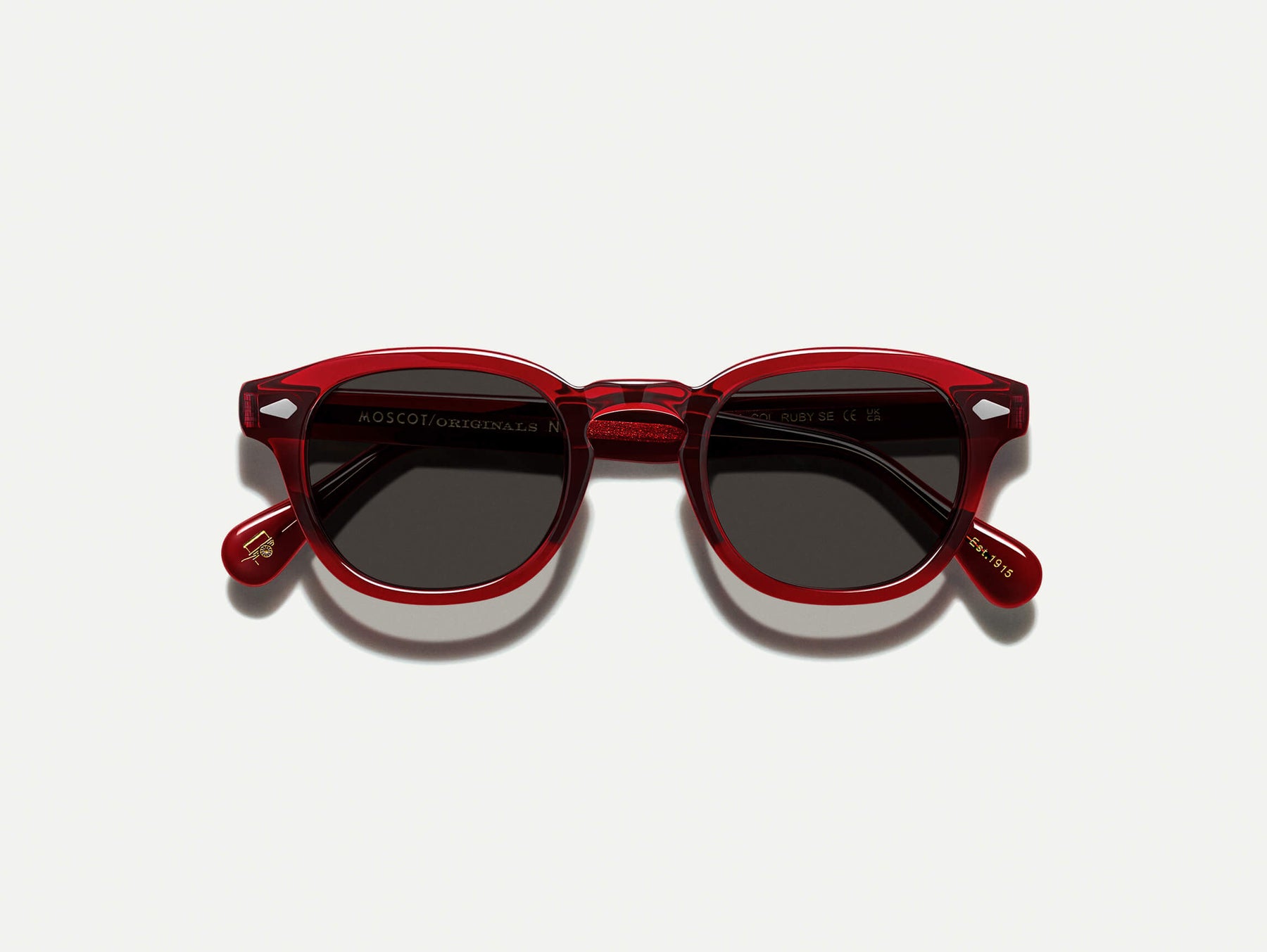 The LEMTOSH SUN in Ruby with Grey Glass Lenses