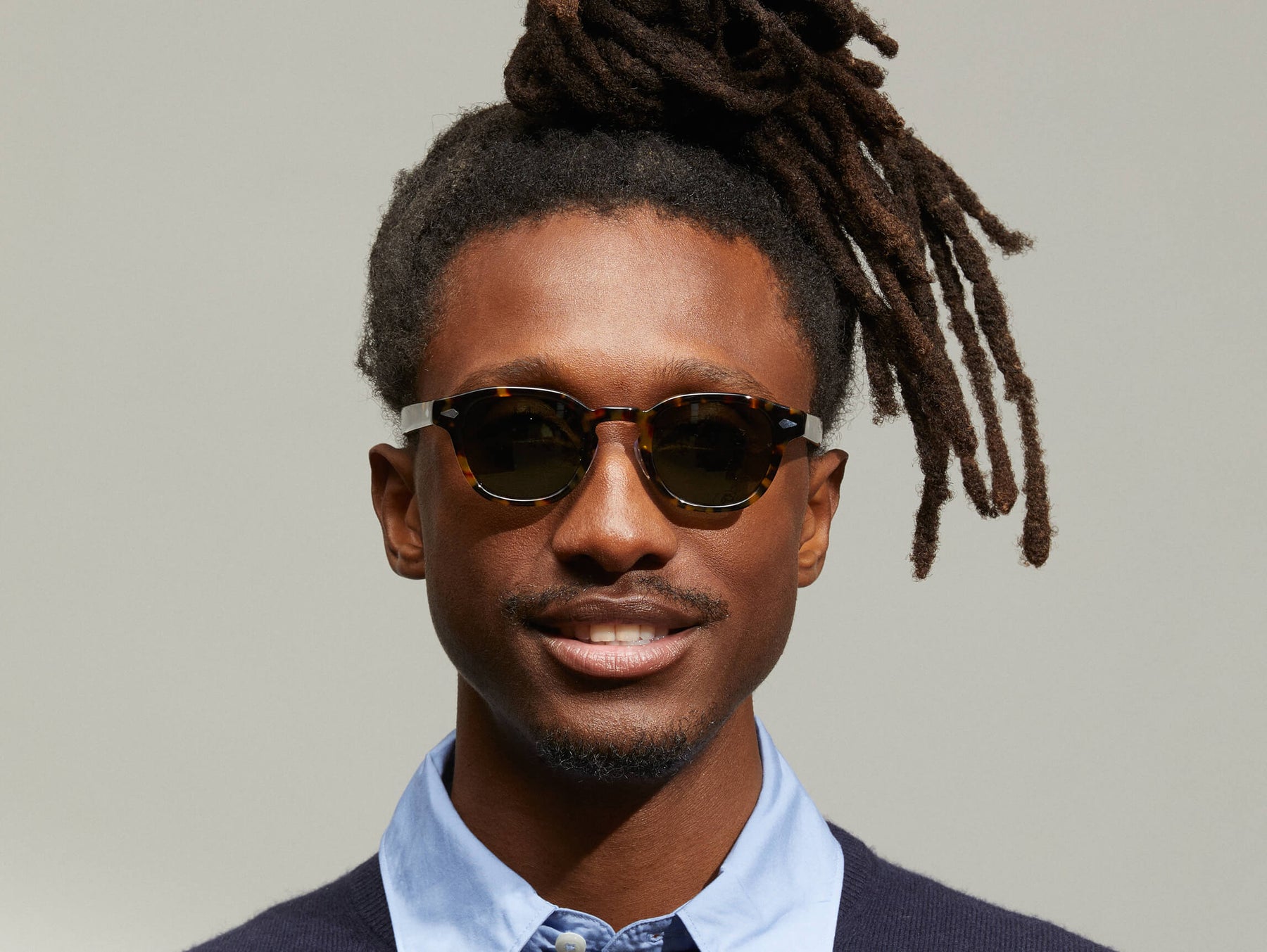 Model is wearing The LEMTOSH SUN with Metal Nose Pads in Tortoise in size 46 with G-15 Glass Lenses