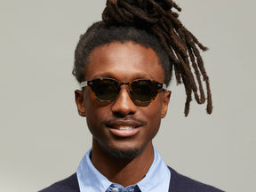 Model is wearing The LEMTOSH SUN with Metal Nose Pads in Tortoise in size 46 with G-15 Glass Lenses