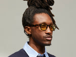 Model is wearing The LEMTOSH in Tortoise in size 46 with Pastel Yellow Tinted Lenses