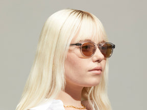 Model is wearing The LEMTOSH in Light Grey size 46 with AMBER+ Tinted Lenses