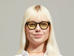Model is wearing The LEMTOSH in Black size 46 with GREEN+ Tinted Lenses