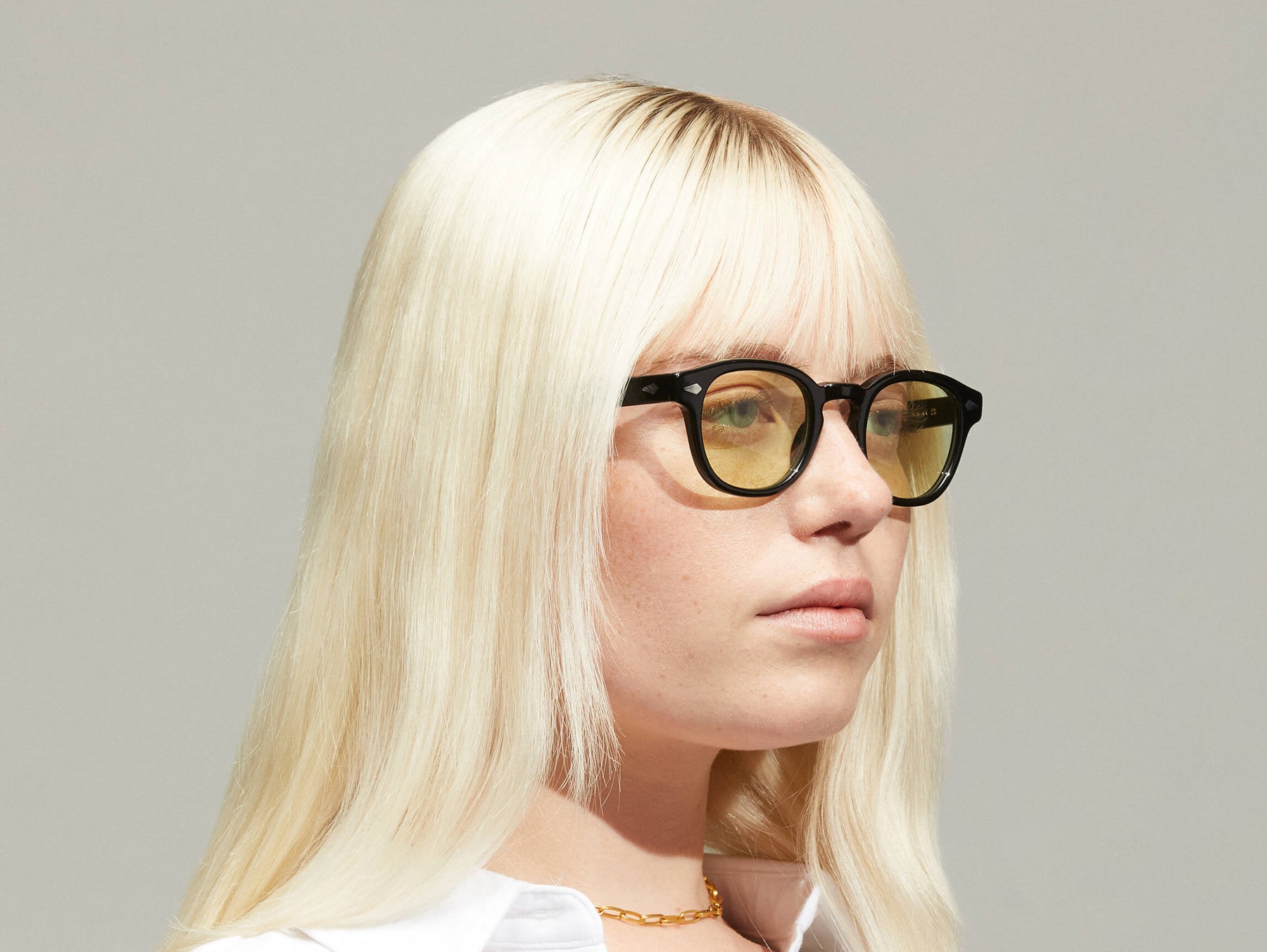 Model is wearing The LEMTOSH in Black size 46 with GREEN+ Tinted Lenses