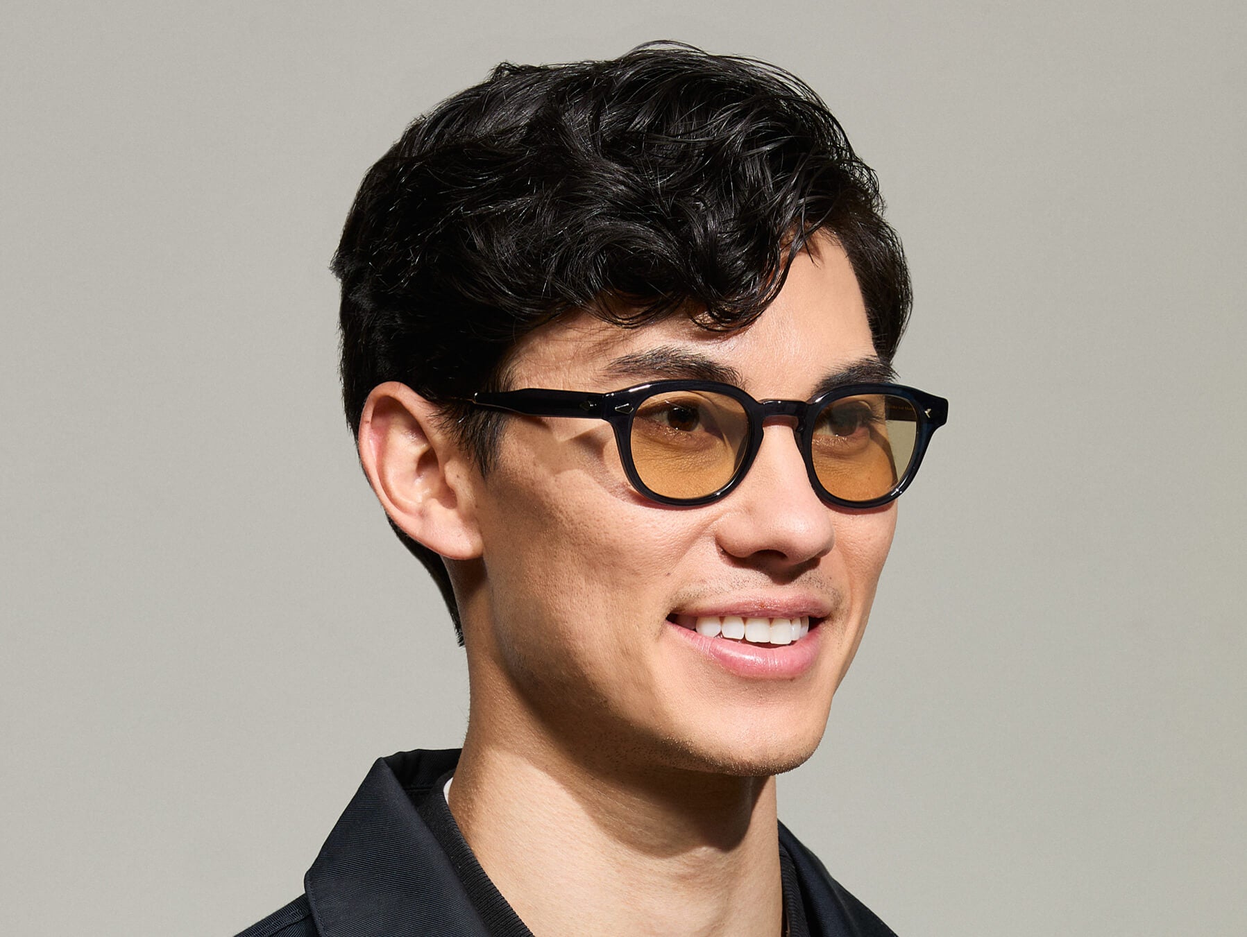 Model is wearing The LEMTOSH-TT 110 SUN in size 46 in Navy/Gold with BROWN+ Lenses