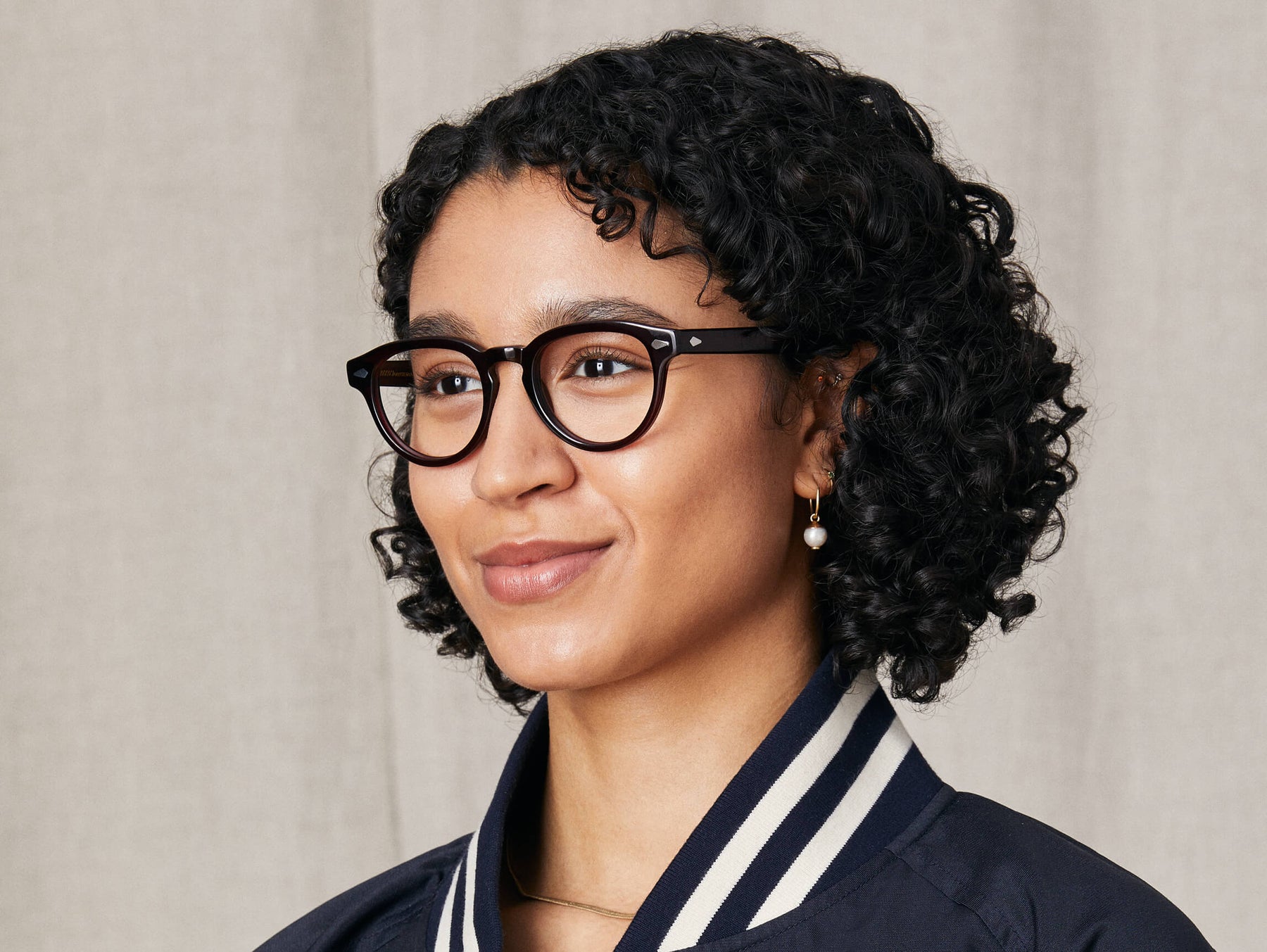 Model is wearing The MAYDELA in size 49 in Burgundy