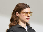 Model is wearing the MILTZEN in Blonde in size 49 with AMBER+ Lenses