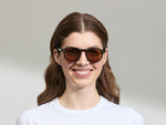 Model is wearing the MILTZEN in Black in size 49 with AMBER+ Lenses