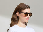Model is wearing the MILTZEN in Black in size 49 with AMBER+ Lenses