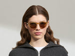 Model is wearing the MILTZEN in Blonde in size 49 with AMBER+ Lenses