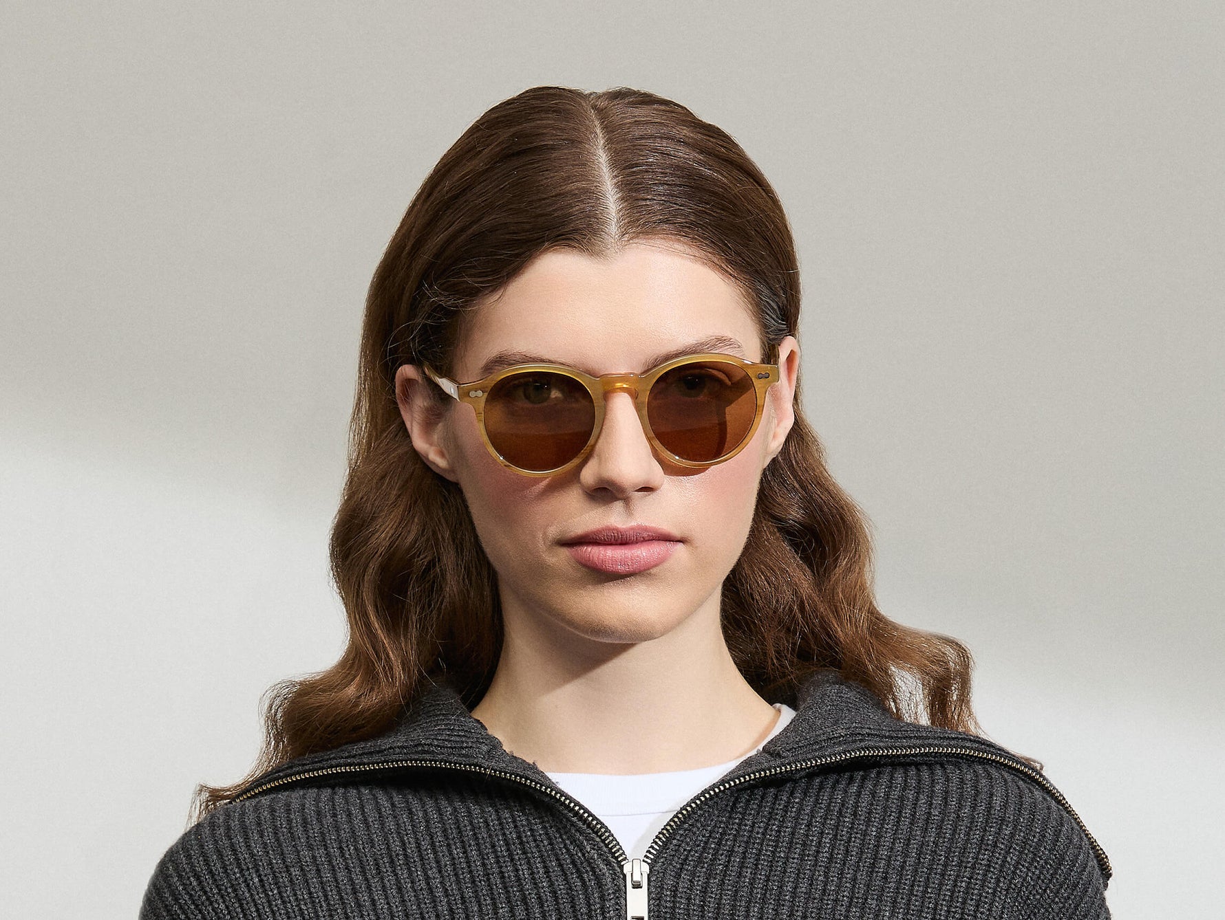 Model is wearing the MILTZEN in Blonde in size 49 with AMBER+ Lenses