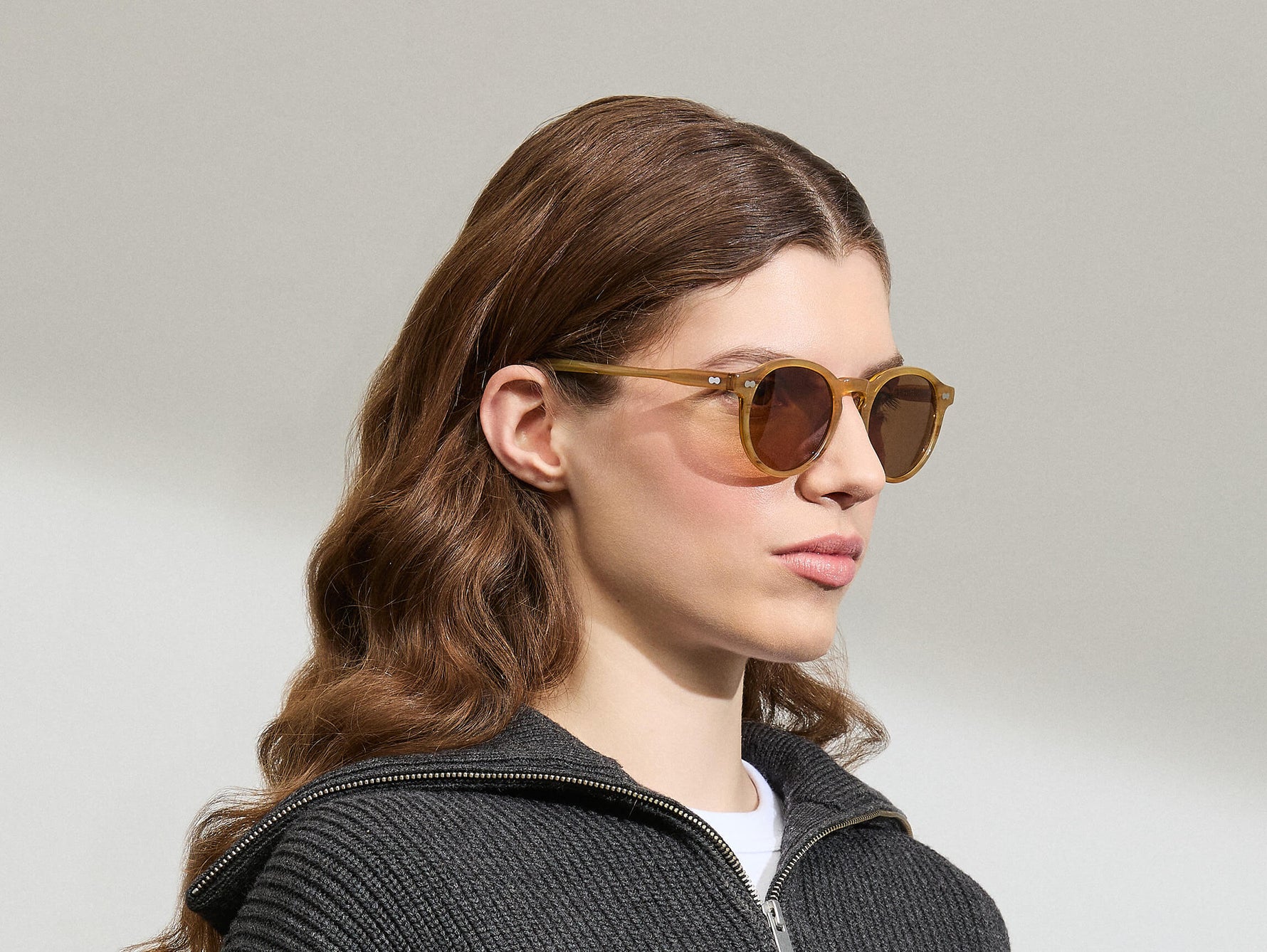 Model is wearing the MILTZEN in Blonde in size 49 with AMBER+ Lenses