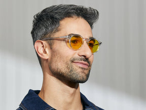 Model is wearing The MILTZEN in Crystal in size 46 with Mellow Yellow Tinted Lenses
