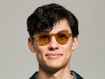 Model is wearing The MILTZEN in Blonde in size 46 with Amber Tinted Lenses