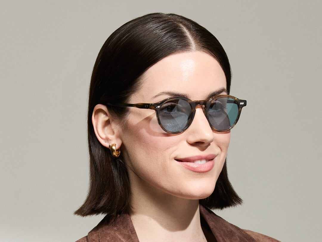 Model is wearing The MILTZEN in Bark in size 46 with Mineral Blue Tinted Lenses