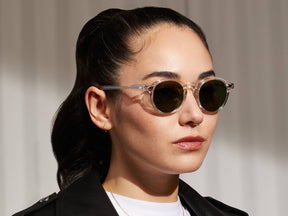 Model is wearing The MILTZEN SUN in Crystal in size 44 with G-15 Glass Lenses
