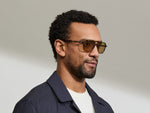 Model is wearing The MINYAN SUN in size 54 in Tortoise with Amber Tinted Lenses