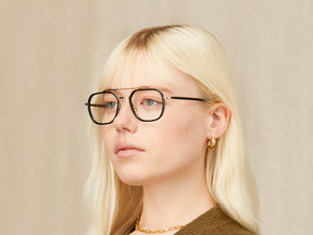 Model is wearing The MIZER in size 51 in Black